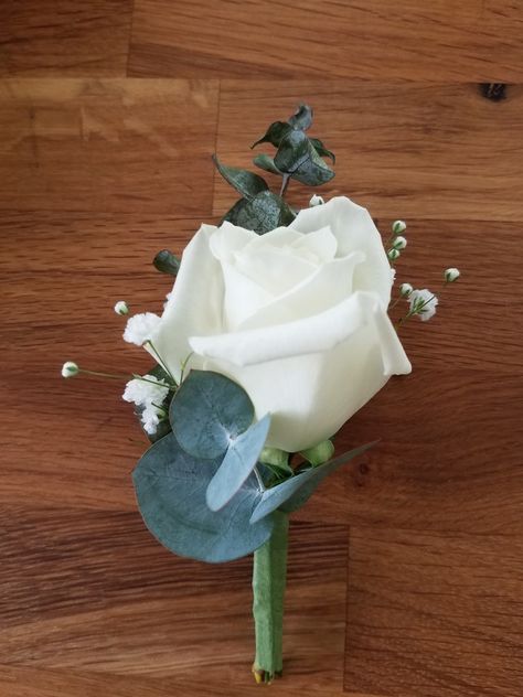 White rose boutonniere with eucalyptus White Rose Buttonhole Groom Boutonniere, Button Holes Wedding Eucalyptus, White Flower Boutonniere Grooms, White Rose And Eucalyptus Boutonniere, White And Eucalyptus Boutonniere, White And Green Buttonholes, Single White Rose Bouquet, White Rose Button Hole, Mens Boutineers Wedding White