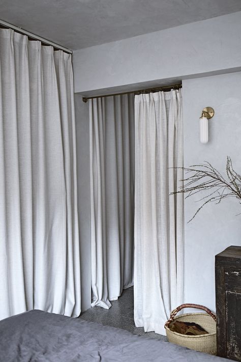 Soft in the City: Mandy Lee's Serene Apartment in Hong Kong - Remodelista Walk In Closet Curtain, Curtain Over Closet, Curtains Over Closet, Closet Curtain, Mandy Lee, Moody Kitchen, Closet Curtains, Rustic Apartment, Riverside House