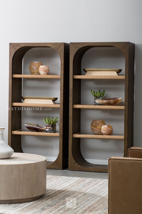 The Nevis Bookcase is a stunning embodiment of contemporary design and functionality. Crafted with precision using oak veneers, rope, and glass in a medium wood finish, it showcases a harmonious blend of natural materials and modern aesthetics. Standing at 76 inches in height and measuring 36 inches in width, this bookcase provides ample space for both display and storage. With three spacious shelves, it offers versatility and organization for your books, decor, or cherished collectibles. The co Shelves Furniture, Contemporary Storage, Shelves For Display, Enclosed Shelves, Book Case Design, Funky Built In Shelves, Contemporary Bookcase Storage, Contemporary Bookshelves, Made.com Bookcase