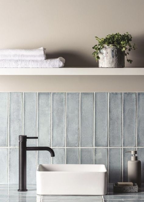 This ceramic glazed wall tile has wonderful colour variation and a textured look. The brick-shaped tile is commonly laid in the herringbone pattern, but here we show you the Montblanc Denim tile stacked vertically on the walls and horizontally on the countertop. It’s a ‘YES’ from us! Small Attic Bathroom, Subway Tile Patterns, Brick Laying, Subway Tiles Bathroom, Tile Layout, Contemporary Tile, Bungalow Renovation, Tile Trends, Subway Tiles