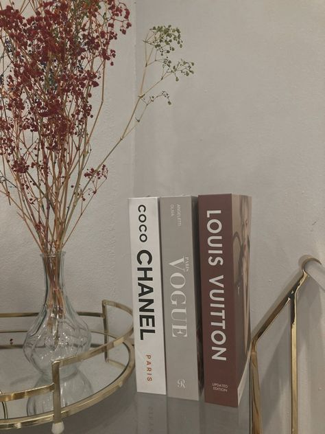 Chanel Dior Book Decor, Vogue Book Decor, Coco Chanel Book Decor, Designer Aesthetic Bedroom Decor, Bedroom Ideas Chanel, Designer Book Aesthetic, Fashion Books Decor Aesthetic, Aesthetic Pictures Chanel, Designer Aesthetic Room Decor