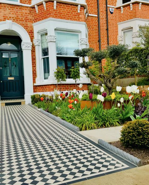 Traditional London front garden with Yellow reclaimed brick walls, Victorian mosaic tiles, Yorkstone steps and coping and resin bound driveway. Finished off with some amazing planting Victorian Front Garden Ideas, Formal Front Garden, Reclaimed Brick Wall, Victorian Mosaic Tile, Victorian Front Garden, Resin Bound Driveways, Small Front Gardens, York Stone, Front Gardens