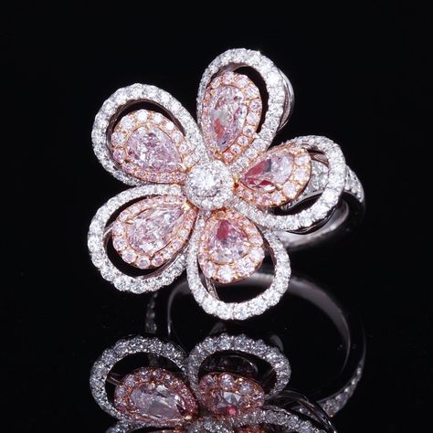 Chic, Fun, and simple. This Fancy Pink Flower Ring is a one of a kind design perfect for any women. 5 matching light pink pear shape diamond surrounded by a pink diamond halo and white rounds. Available to ship in 3-4 weeks. Pink Diamond Wedding Rings, Fancy Pink Diamond Ring, Pink Flower Ring, Pink Diamond Jewelry, Pink Diamonds Engagement, Diamond Flower Ring, Flower Diamond Ring, High Jewelry Ring, Pink Diamond Ring