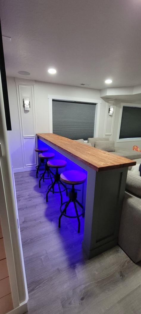 Floating Bar Shelf With Stools, Bar Room Wall Ideas, Basement Bar Stool Ideas, Neon Basement Ideas, Basement Bar Behind Couch, Small Basement Pool Table Room Ideas, Bar Behind Couch Basements, Diy Bar Behind Couch, Led Lights Behind Couch