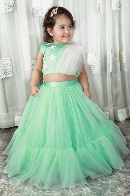 Buy Green Net Embroidery Sequin Stars Crop Top And Lehenga Set For Girls by Darleen Kids Couture Online at Aza Fashions. Kids Choli Designs Latest, Net Crop Top Designs For Lehenga, Crop Top Designs For Kids, Kids Crop Tops Designs, Kids Crop Top Lehenga Designs, Crop Top Lehenga For Kids, Kids Lehanga Design, Crop Top And Lehenga, Lehenga Designs Latest