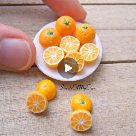 Joanna Tomlinson on Instagram: "⠀⠀⠀⠀⠀⠀⠀⠀⠀ Miniature Oranges - Tutorial Video. 😄 ⠀⠀⠀⠀⠀⠀⠀⠀ Here's how I created my Polymer Clay Oranges in my last post. 😁 ⠀⠀⠀⠀⠀⠀⠀⠀ The tough part of this is getting the cane right. I did a test on the orange colours before making this cane (by baking small amounts of each orange colour). ⠀⠀⠀⠀⠀⠀⠀⠀⠀ Extras: - I use translucent white with a small bit of orange + sunflower yellow. Which gave me the pale orange inside colour. - Cut into segments. - Round the top of each segment then add white to one side. - Fill the spaces (at the top) with white. - Add a layer of white + a layer of orange on top of the segments. - Roll out your cane and begin cutting. - Round into a small ball and cut in half. - I detailed each segment with a needle. - Detail the back and bake. Polymer Clay Fruit Tutorial, Orange Polymer Clay, Oranges Fruit, How To Make Orange, Clay Videos, Orange Sunflowers, Polymer Clay Cane, Sunflower Yellow, Pale Orange