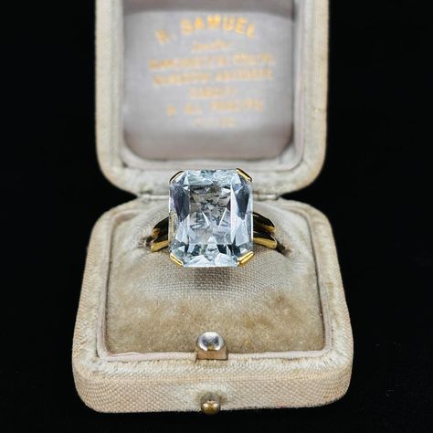 *** UPDATE JUST SOLD *** The colour and clarity on this Aquamarine ring is pretty amazing. This Aquamarine dress ring is from circa 1940’s Portugal. The beautifully rectangular cut Aquamarine totals 9ct, and it’s set in a tasteful four claw setting with a low sitting basket, and a decorative ridge along the band, all in 19K yellow gold. We think this ring is a great investment seeing Aquamarines are now classified as precious, and also particularly now that it is offered at 50% off at $38... Aquamarine Dress, Just Sold, Claw Setting, Aquamarine Ring, Aqua Marine, Aquamarine Rings, Dress Rings, Gold Set, Cushion Cut