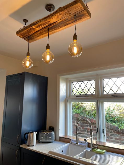 Our wooden beam lighting fixtures are perfect for the dining room as a feature over your dining table, a wonderful way of adding warmth to a living room or kitchen island. Want something special hanging over your bed, or a dramatic feature in your stairwell or entrance foyer? We can design a light that's personal to you. It is a bespoke made to order item and you can be assured that there won't be another like it! The design of this ceiling light is collaborative process, we want to make sure th Log House Lighting, Hanging Lights Over Kitchen Island, Dining Room Lighting Over Table, Beam Chandelier, Beam Lighting, Cluster Pendant Light, Lights Over Kitchen Island, Wooden Beam, Wooden Beams Ceiling