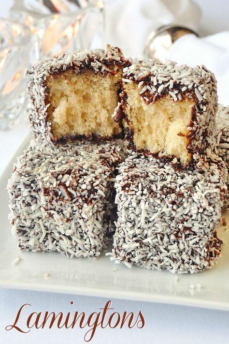 Chocolate Coconut Cake Squares a.k.a. Lamingtons, homemade white cake dipped in a decadent chocolate syrup and then rolled in coconut. An Australian fave! Homemade White Cake, Chocolate Coconut Cake, Homemade White Cakes, Cake Squares, Cake Dip, Rock Recipes, Frozen Cake, Chocolate Syrup, Coconut Cake