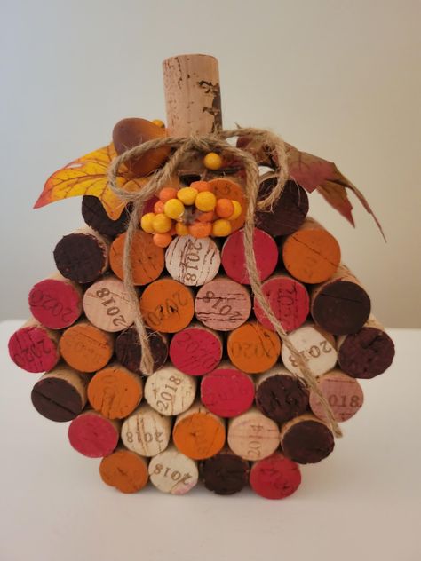 Add a touch of rustic charm to your autumn decor with my handcrafted wine cork pumpkin. Each pumpkin is assembled from reclaimed wine corks, creating a unique and eco-friendly decoration. Hand painted to give that rustic charm. Accented with fall leaves, berries and jute rope bow. Perfect for Thanksgiving table, fall festivals or as a thoughtful  gift. Thanksgiving Cork Crafts, Wine Cork Basket, Wine Cork Star, Wine Cork Pumpkins Diy, Handmade Thanksgiving Decorations, How To Make A Wine Cork Christmas Tree, Cork Pumpkins Fall Crafts, Wine Cork Projects Diy, Wine Bottles Crafts