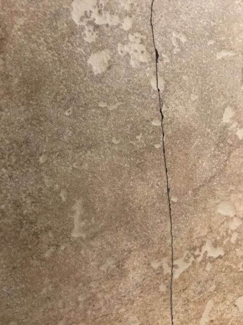 A few of my tiles broke and I wanted to come up with an easy and affordable fix. I came up with this idea and I thought it worked out pretty well, check it out!    I used just a couple of items:  paint  mod podge  brush      The cracks were just a hairline, but it was really bugging me. It was not the right time to change the tiles, so here goes my solution!     Using a paint that is close enough to the tile color as possible, mixed into a small amount of mod podge, I dripped some ont… Cracked Tile Repair, Glass Shower Door Cleaner, Wood Look Tile Floor, Cement Tile Floor, Black Cherry Wood, Tile Repair, Mother Daughter Projects, Tile Color, Patio Wall