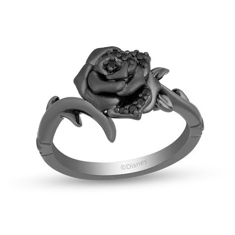 Glistening with mystique, this black diamond rose ring from the Enchanted Disney Fine Jewelry Villains Collection inspired by Maleficent indulges your dramatic side. Crafted in sterling silver with black rhodium plate This design showcases a sandblast-textured bloom set between bypassing thorny vines. Alluring black diamonds adorn the centerpiece while crown insets lower down the shank complete the look. This choice shines with 1/10 ct. t.w. of diamonds. ©Disney Black Rose Ring, Enchanted Disney, Black Diamond Ring, Rose Ring, Black Rhodium, Maleficent, Disney Villains, Black Diamond, Enchanted