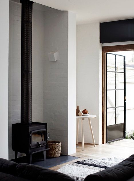 Whiting Architects adds utilitarian extension to Melbourne residence Masculine House, Melbourne House, 아파트 인테리어, Wood Burner, Australian Homes, A Living Room, Scandinavian Home, Wood Burning Stove, Barn House