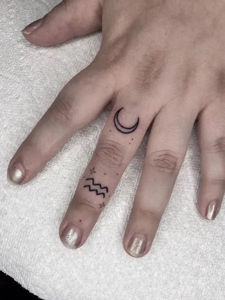 Aquarius Finger Tattoo Aquarius Finger Tattoos For Women, Aquarius Hand Tattoos For Women, Aquarius Tattoo Finger, Finger Tattoos Aquarius, Tattoos Aquarius, Aquarius Hand Tattoo, Aquarius Spine Tattoos For Women, Aquarius Tattoos For Women, Aquarius Tattoos