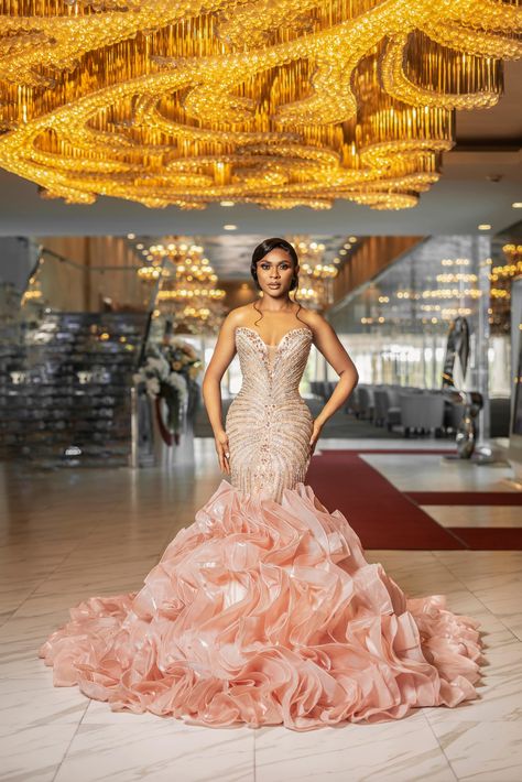 Our Milan gown is the perfect choice for brides who want to feel like princesses on their wedding day. The strapless, peach-colored gown is adorned with jewels and has a mermaid-style silhouette with a built-in corset. The train can be customized into a detachable 2-in-1 dress, making it easy to transition from the ceremony to the reception. 💍👑 To book your consultation to get fitted for our Milan gown, simply visit our website or contact us via phone or email! 📧 For inquiries, please email u 21st Dresses, Mermaid Fashion, Ankara Styles, Get Fit, African Fashion, Wedding Day, Color