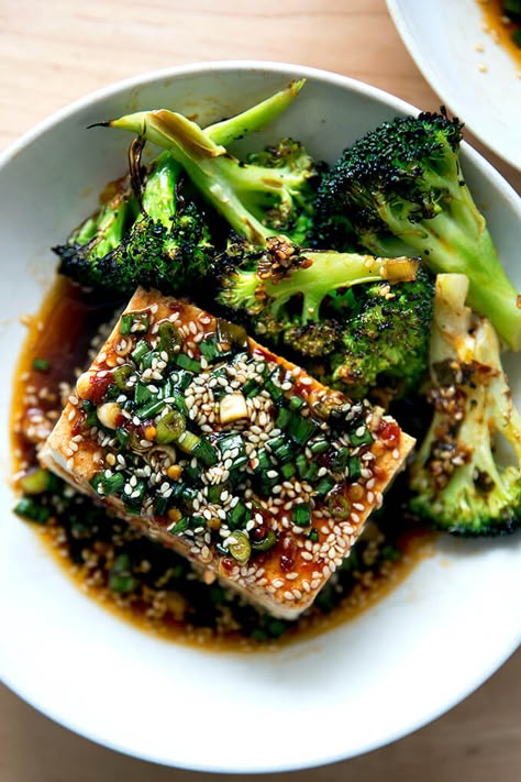 Warm Tofu with Spicy Sesame Sauce — a winter favorite! This is by far the easiest method of preparing tofu I have encountered. The recipe calls for simmering tofu in water — sounds odd but it works — making a sauce, and pouring the sauce over the tofu. It takes no time to prepare, costs very little, and is so incredibly delicious. #tofu #warm #spicy #sauce #sesame #soy Broiled Broccoli, Spicy Garlic Sauce, Mapo Tofu, Sesame Sauce, Green Bean Recipes, Tofu Recipes, Garlic Sauce, In Water, Vegan Vegetarian