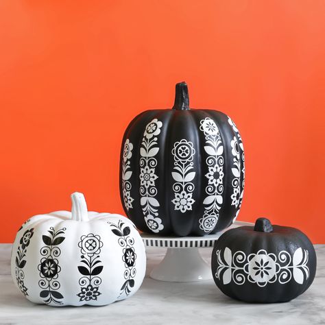 Use adhesive craft vinyl to decorate faux pumpkins with a whimsical folk art design. Free cut file! Pumpkin Painting Ideas Black And White, Pattern Pumpkin Art, Folk Art Pumpkin, Painted Pumpkins Black And White, Intricate Pumpkin Painting, Painted Warty Pumpkins, Fall Decoration, Unicorn Pumpkin, Posca Marker