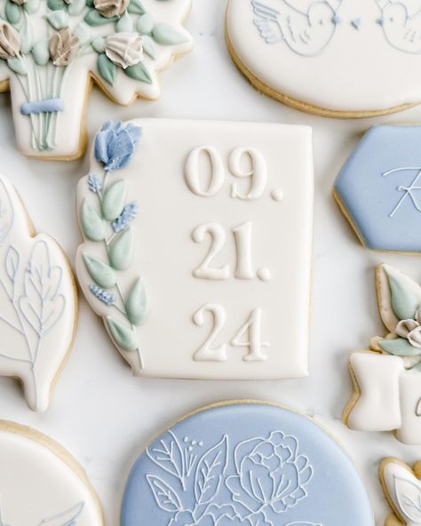 This sweet bridal shower set was winning the polls, so here’s the full set! Swipe to see closeups, including their sweet pups!. My favorite are the simple cookies with the tiny line details. The blue with the white floral, leaf cookie, and the birds were from her invitation! I love this elegant, minimalist, and floral set! . #weddingcookies #bridalshowercookies #bridecookies #floralcookies #flowercookies #somethingbluebridal #bluewedding #springcookies #engagementcookies #ringcookies #dogcoo... Blue And White Cookies, Something Blue Bridal Shower Cookies, Blue Wedding Cookies, Love In Bloom Cookies, Blue Bridal Shower Cookies, Blue And White Bridal Shower Cookies, Floral Wedding Shower Cookies, Bride Cookies, Wedding Shower Cookies