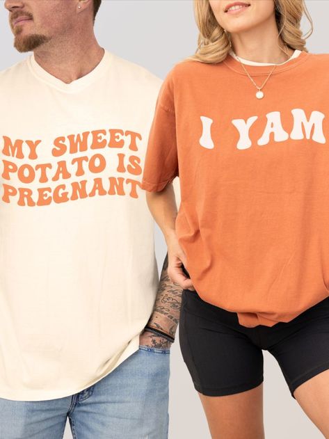 Surprise your family with a sweet and silly Thanksgiving pregnancy announcement! Our "My Sweet Potato is Pregnant, I Yam" matching couple's shirts are the perfect way to share your big news with a touch of fall humor. #ThanksgivingPregnancyAnnouncement #CouplesShirts #ModReveals Couples Pregnancy Announcement, Thanksgiving Pregnancy Announcement, Fall Pregnancy, Fall Pregnancy Announcement, Fall Humor, Funny Couple Shirts, Funny Pregnancy Announcement, Fall Maternity, Pregnancy Announcements