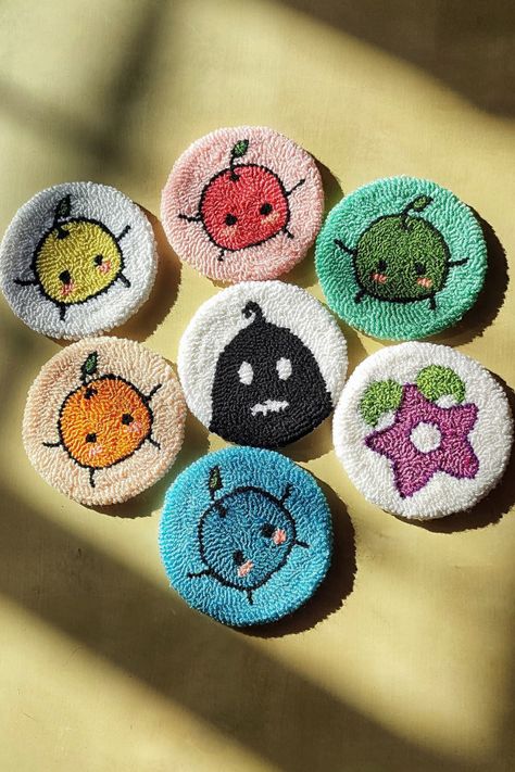 Bring the enchanting world of Stardew Valley into your home with these beautifully crafted punch needle coasters. Featuring Junimos, the Krobus, and the Stardrop, this piece captures the heart of the game. Ideal for adding a touch of Stardew charm to your decor or as a unique gift for fans. Crafted with love, it's a must-have for any Stardew Valley collector. #StardewValleyDecor #StardewValley #GamerGifts #HandmadeCoaster Stardew Embroidery, Stardrop Stardew, Stardew Valley Crafts, Stardew Valley Embroidery, Krobus Stardew Valley, Stardew Valley Crochet, Punch Needle Ideas, Coasters Ideas, Punch Needle Coasters