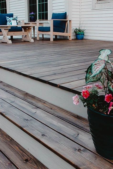 Wooden Deck Colors Ideas Paint, Colored Decks Ideas, Wood Deck Color Ideas, Patio Deck Stain Ideas, Greige Deck Paint Colors, Front Porch Deck Stain Ideas, Deck Staining Ideas Two Tone, Farmhouse Deck Stain Colors, Deck Stain For Grey House