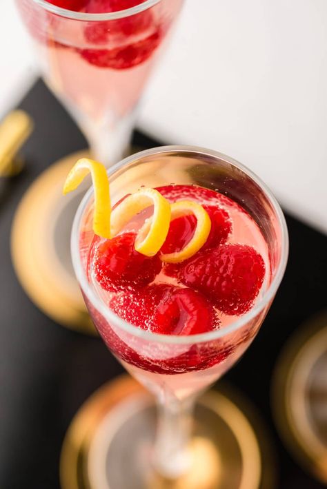 Tart, sweet, and with a bit of a kick, this French Kiss Cocktail is THE perfect cocktail to serve at a celebration. This raspberry and lemon sparking drink is simple to make and so delicious. French Kiss Cocktail, Vermouth Drinks, Olympic Food, Kiss Cocktail, Nye Cocktail, French Cocktails, Raspberry Cocktail, Lexi's Clean Kitchen, Kitchen French