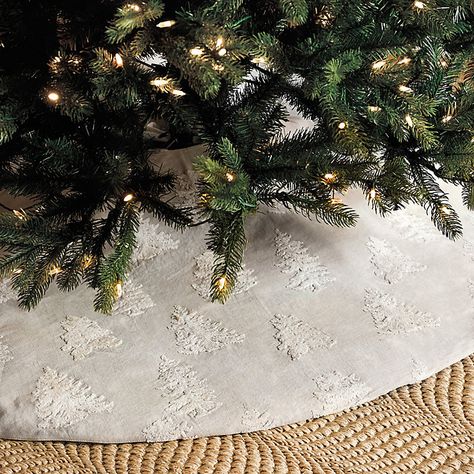 Holiday tradition reimagined in fresh tonal color. Our Embroidered Christmas Tree Skirt is made in a 60-inch round of natural linen-cotton and embroidered in a forest of ivory flocked trees for soft, chenille-like texture. Three ivory velvet bow ties along the split seam let you secure the skirt around your tree. Embroidered Tree Skirt features: Coordinates with our Embroidered Stocking Hand finished Velvet bow ties Made of linen-cotton blend Natural linen reverse Imported Embroidered Tree Skirt, Vintage Tree Skirt, Embroidered Stocking, Embroidered Christmas Tree, Embroidered Tree, Burlap Tree Skirt, Embroidered Stockings, Holiday Furniture, Velvet Bow Tie