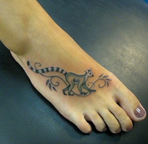 Simple elegant gray-ink lemur tattoo on foot Lemur Tattoo, Cloud Tattoo Sleeve, Tattoo On Foot, Yellow Rose Tattoos, Surf Tattoo, Tattoo Animal, Key Tattoos, Cloud Tattoo, Awesome Tattoos