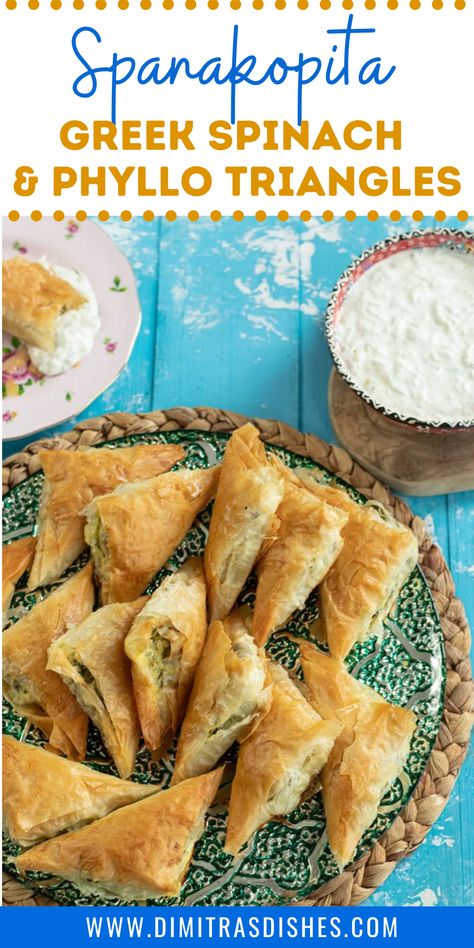 Spanakopita has got to be one of the most well known Greek appetizers on the planet. Spinach, herbs, and creamy feta cheese are wrapped in a flaky phyllo pastry. So much to love about these little triangles! Especially when they’re served with tzatziki! Make an extra batch for the freezer. #spanakopita #spinachpie #greekrecipes #greekfood #appetizers #dimitrasdishes Spanicopita Recipe, Spanakopita Triangles, Greek Pie, Spanakopita Recipe, Greek Spinach, Phyllo Recipes, Greek Spinach Pie, Phyllo Pastry, Greek Recipes Authentic