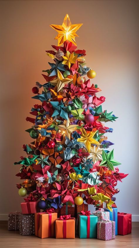 Colorful origami Christmas tree made of paper stars with wrapped presents underneath Non Traditional Christmas Tree, Alternative Christmas Tree Diy, Creative Christmas Tree Ideas, Folded Stars, Christmas Tree Alternatives, Traditional Christmas Tree Ideas, Origami Tree, Whimsical Christmas Tree, Origami Christmas Tree