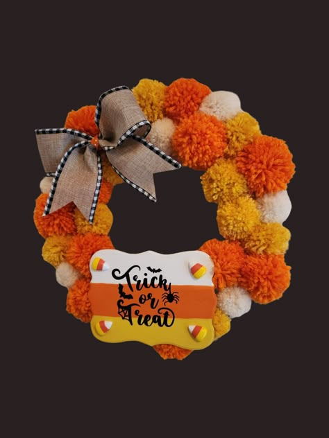 Pom Pom Candy Corn wreath. It's sure to brighten up either Front door or any wall 8n your home. Very festive for the fall Halloween Season Halloween Pom Pom Wreath, Halloween Pompom Garland, Autumn Pompom Wreath, Pompom Christmas Wreaths, Cardboard Wreath Form, Diy Autumn Wreath, Autumn Pom Pom Garland, Fall Yarn Wreaths, Christmas Pom Pom Crafts