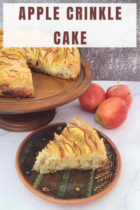 This recipe for an Apple Crinkle Cake creates a dessert with juicy apple slices, a flaky top, honey-sweetened walnuts and a cinnamon-spiced custard. Though it may seem complicated, just follow the recipe, and you'll have a delicious dessert in no time. A crinkle cake is a dessert known for its unique, crinkled texture on the surface. The folds of phyllo dough give it a slightly wrinkled, crinkly appearance. Try this Apple Crinkle Cake Recipe! Apple Phyllo Crinkle Cake, Apple Crinkle Cake, Apple Honey Dessert, Phyllo Crinkle Dessert, Crinkle Cakes, Phyllo Crinkle, Crinkle Cake, Honey Dessert, Creamed Honey