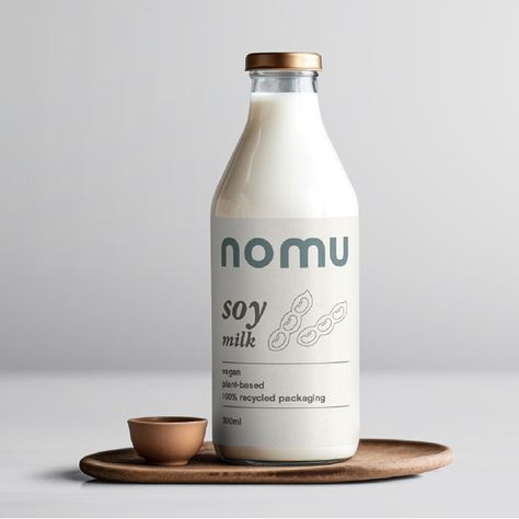 Introducing Nomu - an alternative, vegan milk brand offering Almond, Soy and Oat milks. I had fun creating this passion project - thank you to @briefclub for the brief! . . . . . . . . #briefclub #passionproject #veganmilk #brandidentitydesign #graphicdesigner #packagingdesign #graphicdesignisfun #blackbritishgraphicdesigner #adobeillustrator #adobephotoshop #femalegraphicdesigner #adobecreativecloud Plant Milk Packaging, Soy Milk Packaging, Plant Based Milk Photography, Oat Milk Packaging, Plant Based Milk Packaging, Bottle Photography, Milk Brands, Graphic Desi, Vegan Milk