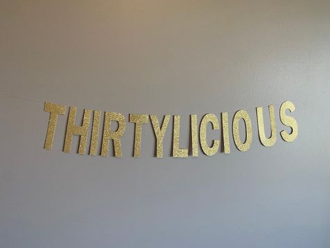 "THIRTYLICIOUS banner Congratulations on your upcoming awesome party   This banner is made from heavy glitter card stock and can be customized to the color of your choosing.  The \"THIRTYLICIOUS\" banner is about 2.5 feet long with letters that are 5 inches tall. The banner is pre-strung and ready for hanging upon its arrival.  The banner is strung with clear string with plenty of extra string on each end.   My current turn around time is 1-3 days    If you don't see something you absolutely lov Birthday Party 30 Women, 30th Birthday House Party Ideas, 30 Birthday Party Themes, Chapter 30 Birthday, 30th Birthday Ideas For Women Decoration, Funny 30th Birthday Ideas, Sweet 30 Birthday, 30th Themed Birthday Party, Male 30th Birthday Ideas