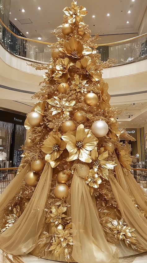 Luxurious gold Christmas tree with golden flowers and ornaments in an elegant shopping mall, creating a festive holiday Gold Metal Christmas Tree, Bows And Tinsel Christmas Tree, All Gold Christmas Tree, Floral Christmas Tree Ideas, Gold Theme Christmas Tree, Gold Flocked Christmas Tree, Magnolia Christmas Tree, Gold Silver Christmas Tree, White And Gold Christmas Decor