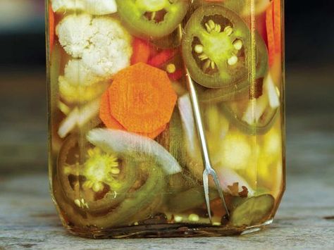 The spicy combination of pickled jalapeños, carrots and onions known as escabeche gets a twist with cauliflower in this recipe from Tacolicious. Canning Cauliflower Jalapeños Onions Carrots, Escabeche Recipe, Canned Jalapenos, Pickled Cauliflower, Japanese Pickles, Pickled Foods, Spicy Pickles, Jalapeno Recipes, Pickled Carrots