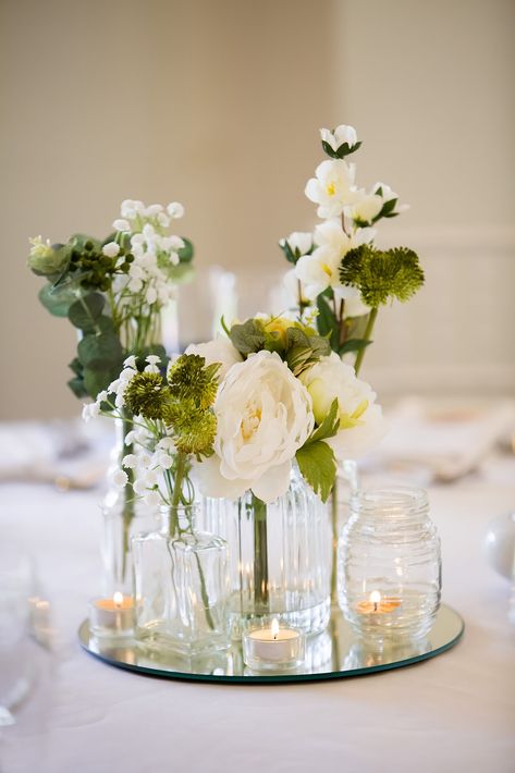 Bulb Vases Wedding Centerpieces, Centerpieces Wedding Mirror, Frameless Candle Centerpiece, Round Mirror Centerpiece Wedding, Round Mirror Centerpiece Ideas, Vase And Candle Centerpieces, Mirrored Centerpieces Wedding, Bud Vases On Circle Table, Flower Centrepiece For Round Table