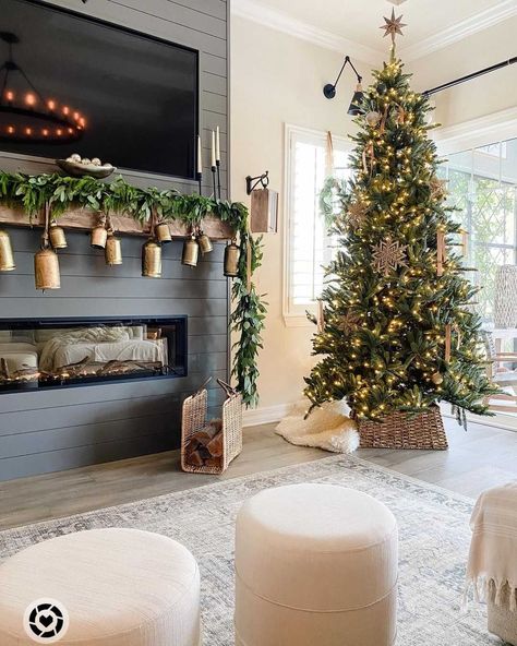 We LOVE this Christmas tree, dark shiplap, and gold bells!🤩 +TAP the link in bio for a similar look!! 📸@thedailynest #mantel #manteldecor #mantle #mantledecor #fireplace #fireplacedecor #christmasdecor #christmasdecorations #christmastree #winterdecor #livingroom #livingroomdecor #livingroomdesign #neutralhome #shiplap #modernfarmhouse #farmhouselove #farmhousedecor #farmhousestyle #farmhouseliving #cozyspaces #modernfarmhousestyle #entrwaydecor #entrydecor #farmhousechic #cottagestyle Cozy Christmas Decor, Neutral Christmas Decor, Christmas Decor Inspiration, Christmas Mantel, Christmas Mantel Decorations, Christmas Mantle, Christmas Living Rooms, Christmas Inspo, Christmas Decorations For The Home