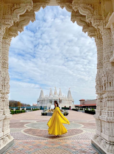 Hello Jalebi Anarkali outfit worn by Chicago blogger BrownGirlStyles at the Baps Mandir.  Twirling #Mughal #mughalfashion #Yellowdress #fantasyphotography Mandir Dress Look, Yellow Desi Outfit, Mathura Vrindavan Outfit Ideas, Poses In Anarkali Dress, Vrindavan Outfit, Vrindavan Outfit Ideas, Vrindavan Aesthetic, Anarkali Outfit, Vrindavan Photography