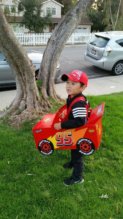 Homemade Lightning McQueen Halloween costume. Made from recycled amazon prime box Diy Lighting Mcqueen Costume, Homemade Lightning Mcqueen Costume, Diy Cars Costume, Halloween Costume For Kids Boys, Cars Theme Halloween Costume, Cars Disney Costume, Halloween Costume Kids Boys, Pixar Cars Halloween Costumes, Cars Family Halloween Costumes