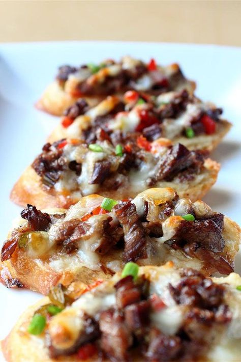 These mini philly cheesesteaks are a quick and easy appetizer recipe! Bake the best crostini recipe using provolone cheese, skirt steak, sweet peppers, and baguettes. If you love philly cheesesteak sandwiches, you will love baking these philly cheesesteak snacks for an appetizer at a football tailgate party, potluck, or dinner party! Steak Appetizers, Chef John Recipes, Philly Cheesesteaks, Tailgate Snacks, Bacon On The Grill, July Recipes, Philly Cheese, Cheese Steak, Food Wishes