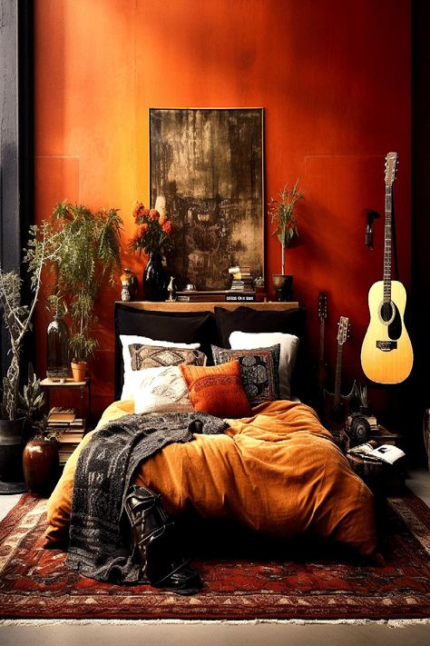 colored wall, artwork, and a guitar. Rusty Red Bedroom, Earthy Dressing Room, Rust Bedroom Ideas, Red Bedroom Decor Ideas, Black And Rust Bedroom, Moody Spaces, Rust Bedroom, Burnt Orange Bedroom, Moody Maximalist