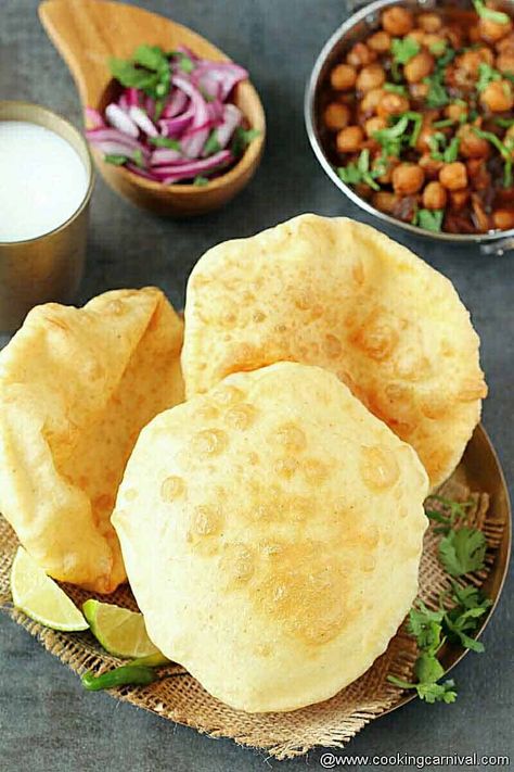 One of North India’s most popular puffed deep-fried bread – Bhatura. It is made with All-purpose flour (Maida) and served with Chole masala. This dish is one of the most eaten breakfast/snack in the Northern part of India. It can be also served as a breakfast as well as lunch or dinner. Hot Bhature along with spicy tangy Chole, it’s THE BEST food on the earth. The combination of chole masala and deep-fried bhatura makes it an exotic recipe. #bhature #indian #chole #chanamasala #indianfrybread Batura Recipe, Chole Bhature Recipe, Bhature Recipe, Bhatura Recipe, Chole Bhature, Chole Masala, Indian Meal, Naan Recipe, Indian Bread