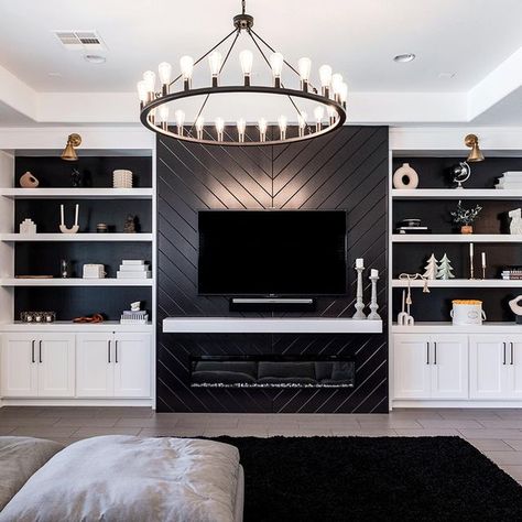 👋🏻 Hi I’m Kelly on Instagram: "When black and white is the vibe 🖤🐇 It’s pretty cool that I get to design and build spaces like these. Sometimes the “I love my job” feeling creeps in and I remember how lucky I am. Design by: @kelly.e.stone 📸 by: @kristinelizabethstudio" Feature Wall With Tv And Electric Fireplace, Tv Wall Black And White, White And Black Built Ins, Loft Built Ins With Tv, Black And White Entertainment Center, Modern Black And White Fireplace, Black Wall White Shelves, White Black Media Wall, Basement Black And White