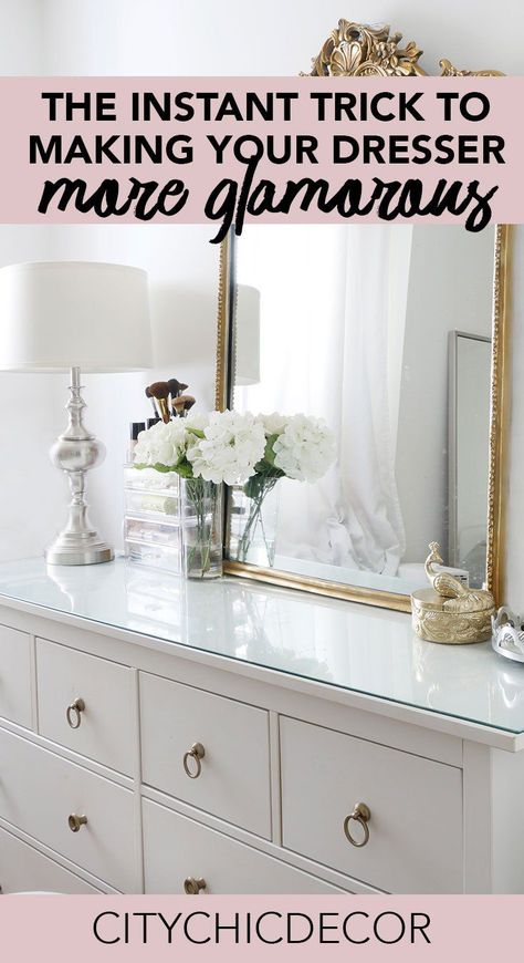 Struggle to find ways to create a glam dresser? Use these tips to makeover a dresser that'll up your bedroom game. #smallbedroomideas #bedroomideas #bedroomdecor #dresserdecor #dressermakeover #dresserorganization Mixed Dressers In Bedroom, How To Decorate Your Dresser Top Master Bedrooms, Mirror Over Bedroom Dresser, Bedroom Dresser Decor Ideas Minimalist, Bedroom Dresser With Mirror Decor Ideas, Glam Small Bedroom Ideas, Curtains Behind Dresser, Bedroom Mirror Ideas Over Dresser, How To Style A Dresser Top Bedroom