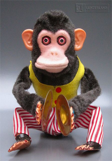 Vintage MUSICAL JOLLY CHIMP - 1950s Battery Operated MUSCIAL JOLLY CHIMP from the 1950s by CK-Daishin of Japan.The 10" tall chimp wildly plays his cymbals, but then push on the top of the head and he freaks out - shrieking, eyes bulge out, and he shows his teeth (really not quite so "jolly"). Recently featured in the Pixar film TOY STORY 3. Jolly Chimp, Circus Gifts, Looks Hip Hop, Rick And Morty Poster, Creepy Toys, Toy Monkey, Old School Toys, Pixar Films, Toy Story 3