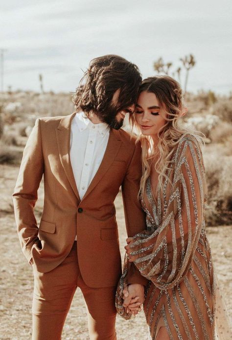 This terra cotta colored groom's suit + the bride's rose gold and silver dress are perfect desert wedding attire | Image by Karra Leigh Photo Glam Wedding Dress, Joshua Tree Wedding, Fever Dream, Gold Wedding Dress, Dream Fashion, Boho Glam, Wedding Boho, Glam Wedding, Tree Wedding