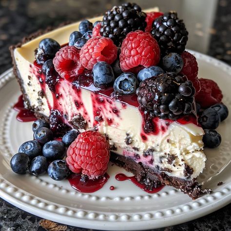 🍓🍰 Indulge in the midnight magic of this creamy berry bliss! #BerryBliss #MidnightCheesecake 🍽️ Midnight Berry Bliss Cheesecake 🛒 Ingredients: Crust: 2 cups crushed chocolate cookies 1/2 cup butter, melted Filling: 3 packages cream cheese, softened 1 cup sugar 3 eggs 1 tsp vanilla extract Berry Topping: 2 cups mixed berries (blueberries, raspberries, blackberries) 1/4 cup sugar 1 tsp lemon juice 👩‍🍳 Instructions: Prepare Crust: Mix cookie crumbs and butter. Press into the bottom of a spri... Baking Pictures, Berry Topping, Berry Cheesecake, Twisted Recipes, 3 Eggs, Blueberry Cake, Trending Recipes, Cookie Crumbs, The Midnight