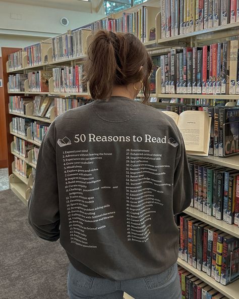 Readers all know there's a million different reasons to pick up a book, but you can't fit all that on a sweater! So here's 50 of them :) This crew's design is printed in white onto a pepper gray crew made of 50% cotton and 50% polyester. The front features a printed book decal. Crews are preshrunk, so don't worry about shrinkage in the wash! For sizing information, please refer to the size chart provided in the listing. Because each crewneck is handmade by me, the current processing window for orders (not including shipping time) is 4-6 weeks. Please understand that I unfortunately am not able to offer expedited or rushed processing at this time.  Do you need a size not offered on the listing? Do you want a custom color combo? Just let me know! Please reach out via Etsy and we can work som Reading Shirt Ideas, Bookish Gift Ideas, Book Nerd Aesthetic Outfit, Book Sweatshirts, Bookish Sweatshirts, Book Lover Gift Ideas, Book Sweater, Reasons To Read, Book Outfits