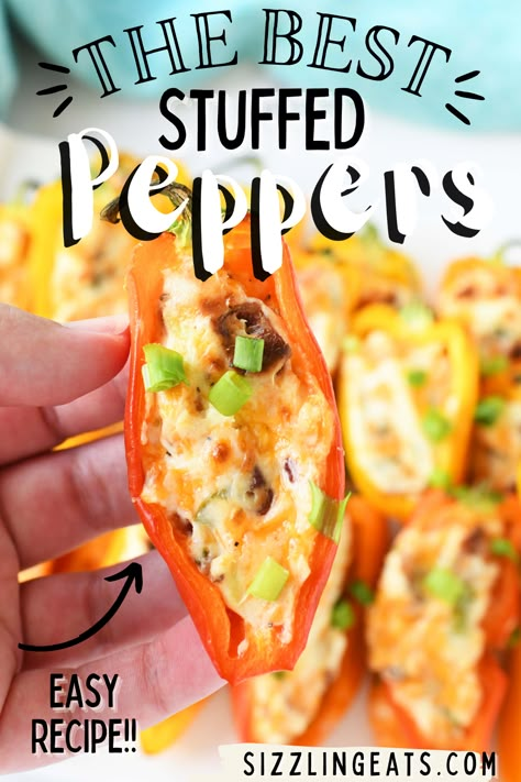 Sweet and savory stuffed peppers in a hand. Stuff Mini Peppers Appetizers, Dip For Mini Sweet Peppers, Recipes Using Mini Sweet Peppers, Baked Stuffed Mini Peppers, Sausage Stuffed Sweet Peppers, Bacon Wrapped Stuffed Peppers, Cream Cheese Filling For Peppers, Small Peppers Appetizers, Stuffed Mini Peppers Appetizers Cold